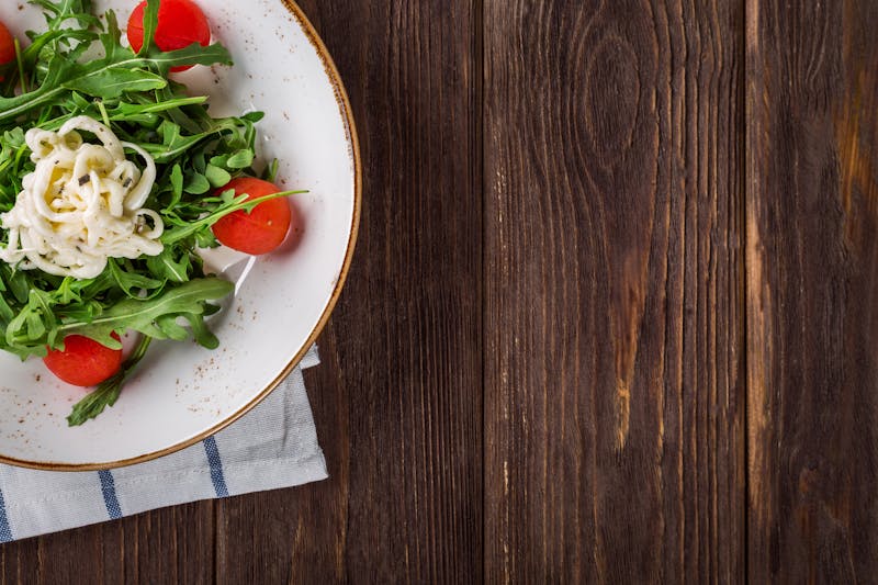 Fresh arugula salad with lemon dressing